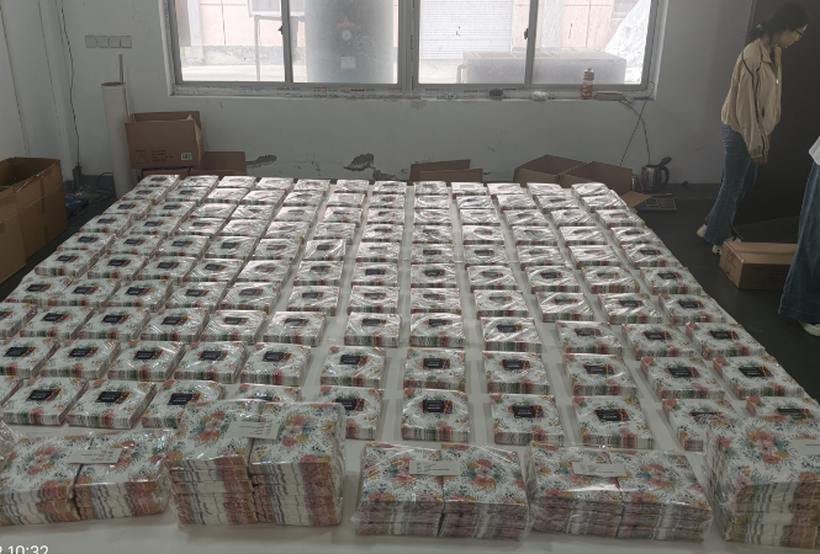 Inspection team checking napkin pack stacks by hand